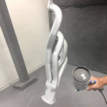 Load image into Gallery viewer, Small block header 12 cylinder engine component treated with the ZyBar product in aluminum color